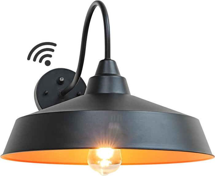 Black wall-mounted light fixture with a dusk to dawn symbol on a white background