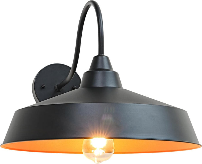 Black wall-mounted lamp with a lit bulb on a white background