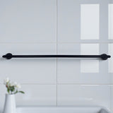 Black towel bar mounted on a white tiled wall