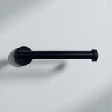 Black minimalist toilet paper holder mounted on a white wall