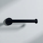 Black minimalist toilet paper holder mounted on a white wall