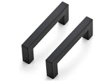 Two black cabinet handles on a white background