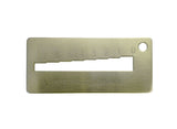 A Kwikset metal key gauge decoder with numerical markings and a slot for inserting a key.